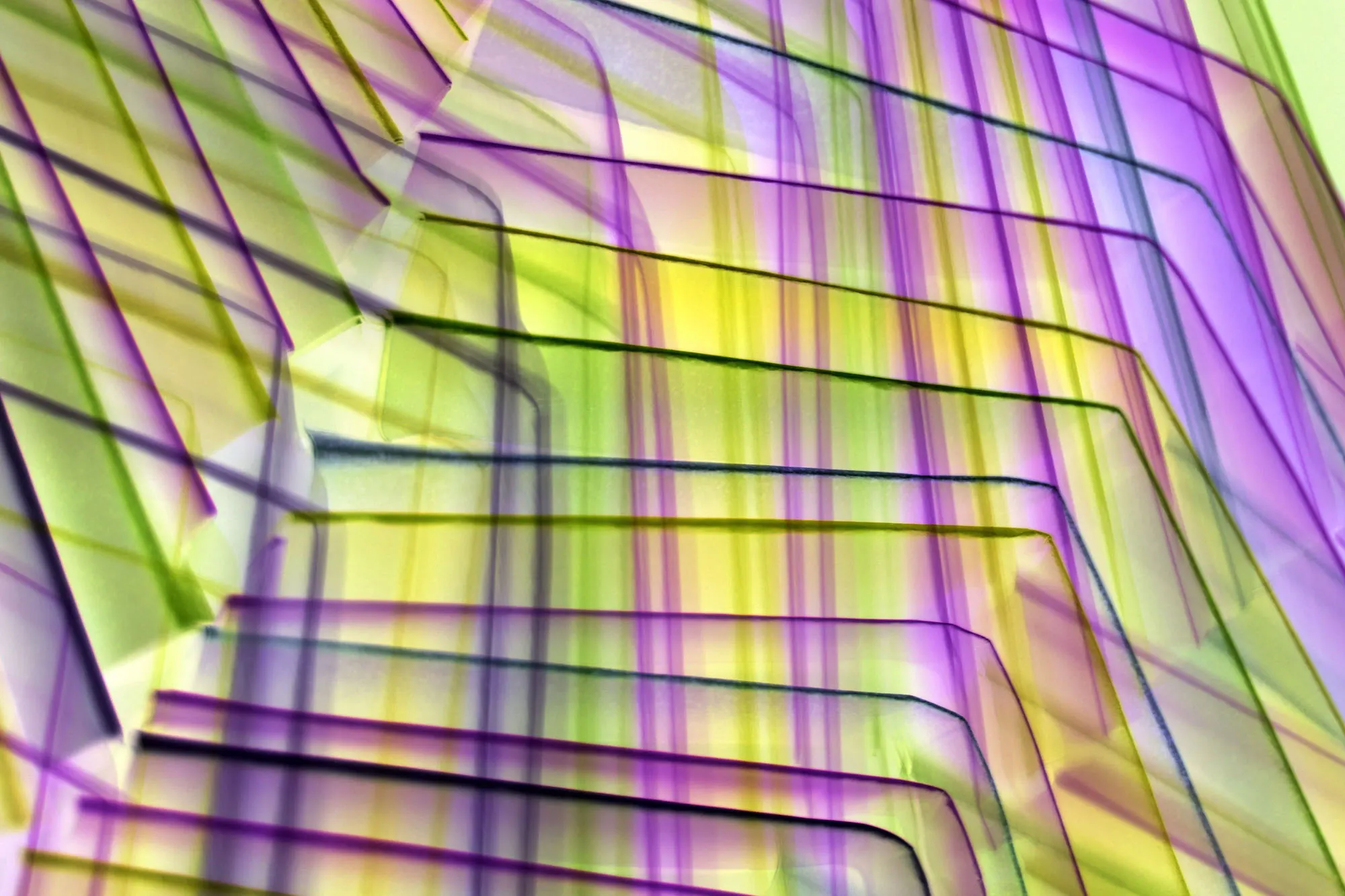 Bent acrylic sheets with yellow and violet reflections